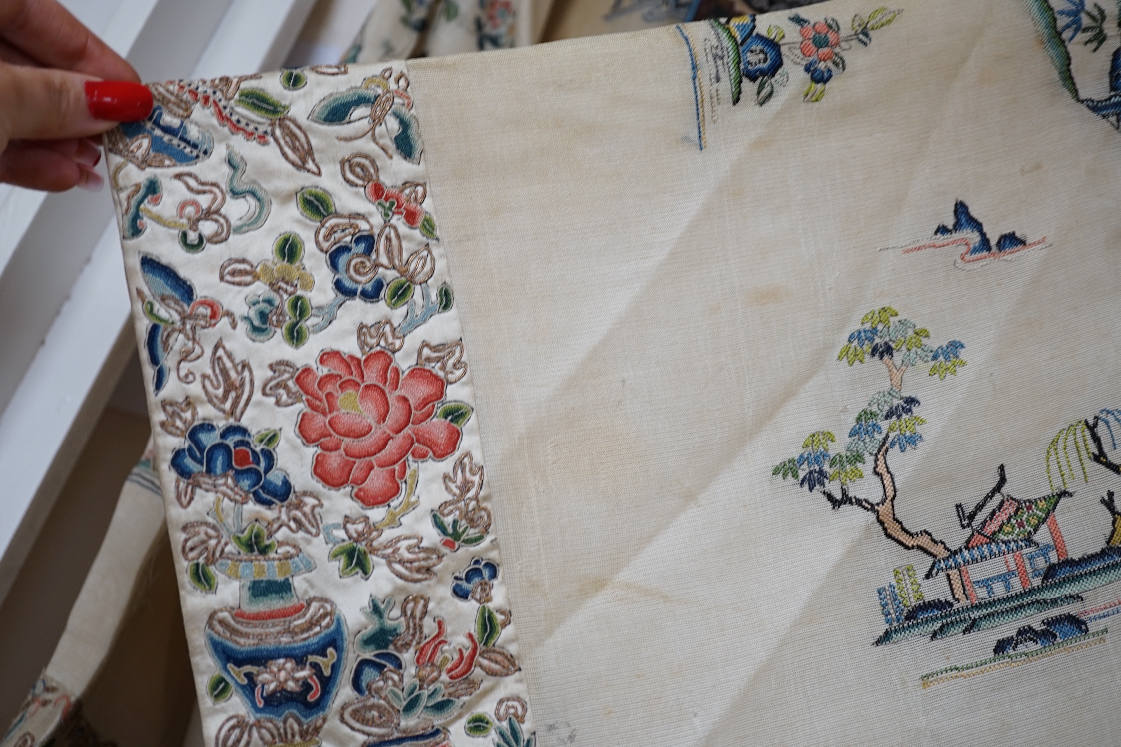 A late 19th/early 20th century Chinese gauze summer robe embroidered with flowers, figures and pagodas, 85cm high